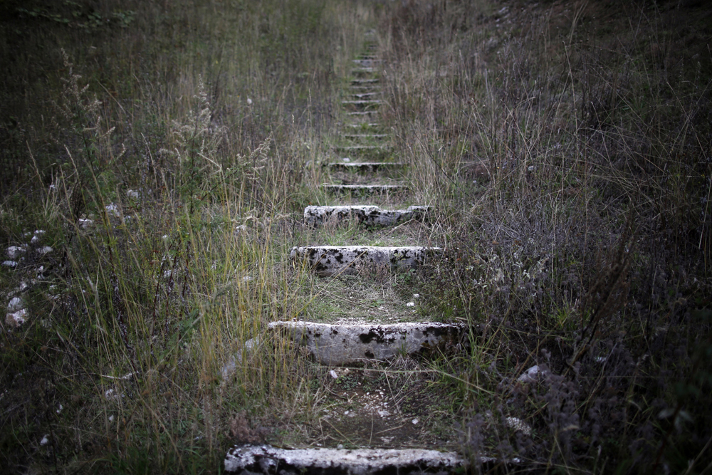 A view of worn stone steps which lead to the disused ski jump from the Sarajevo 1984 Winter Olympics on Mount Igman, near Saravejo